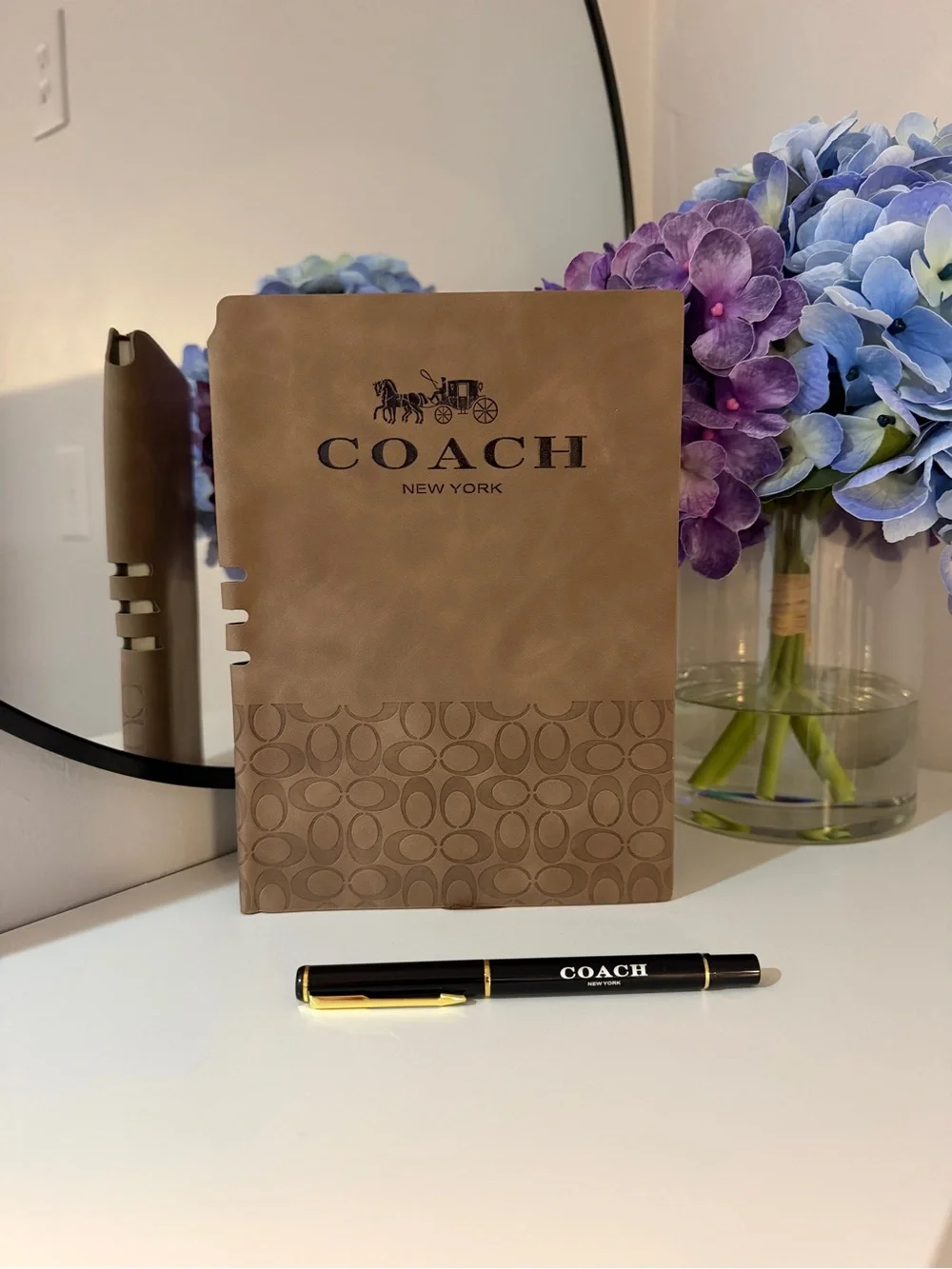 COACH Brown Signature Leather Notebook - COACH New York with a Pen